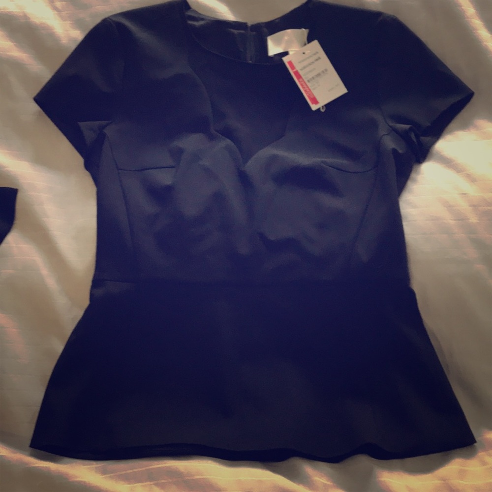 Stunning structured black top with sheer panel